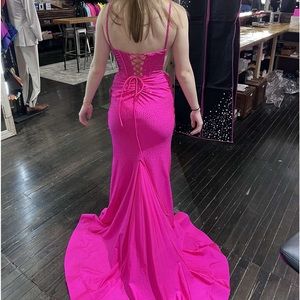 A bright pink prom dress only worn once bought from ducky’s